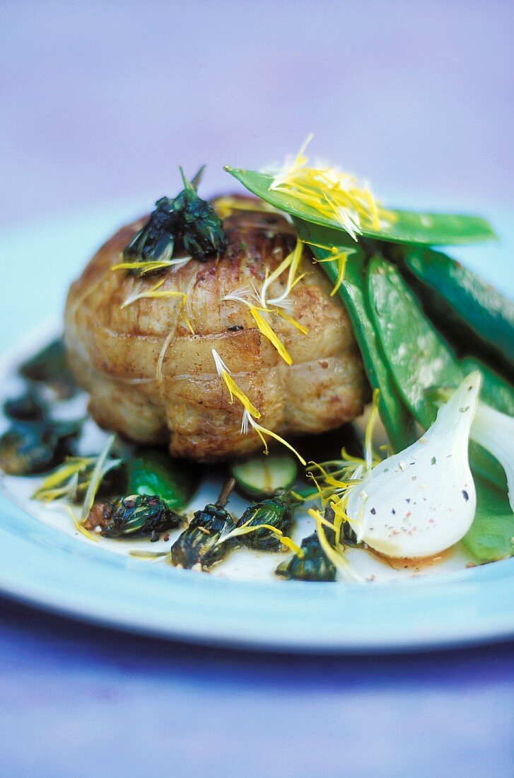Roast veal thick flank with dandelion flowers