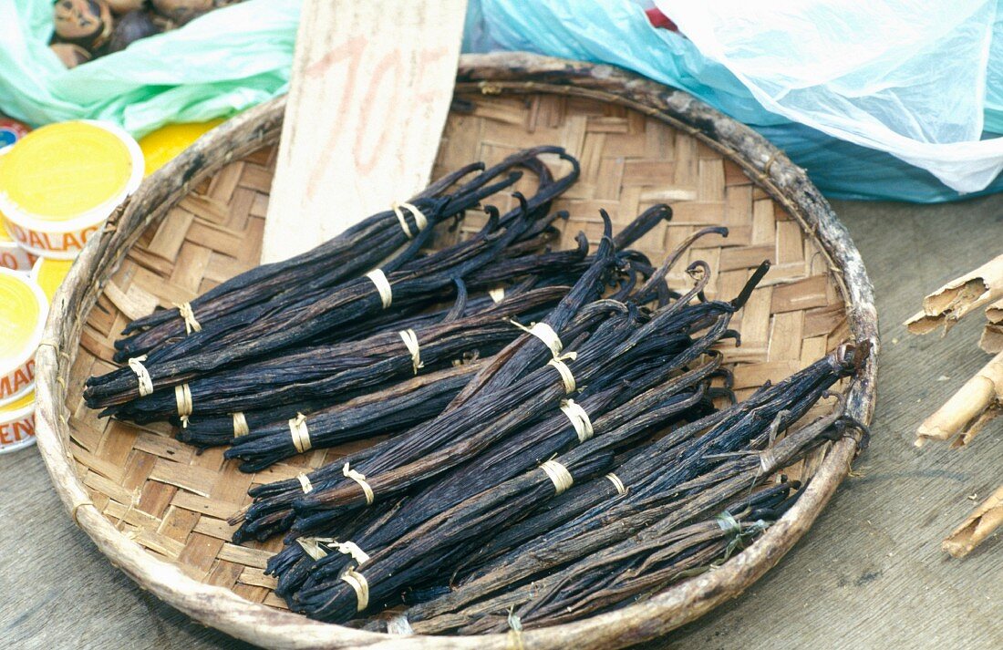 Bundles of vanilla pods in a basket, La Réunion, Caribbean