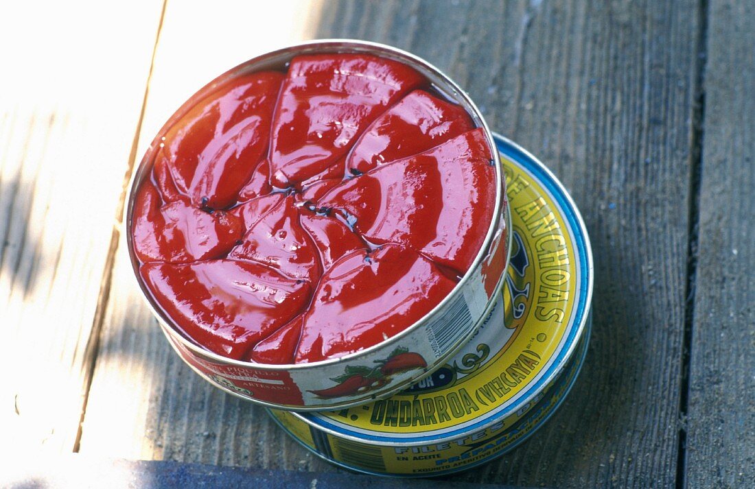 A tin of peppers preserved in oil