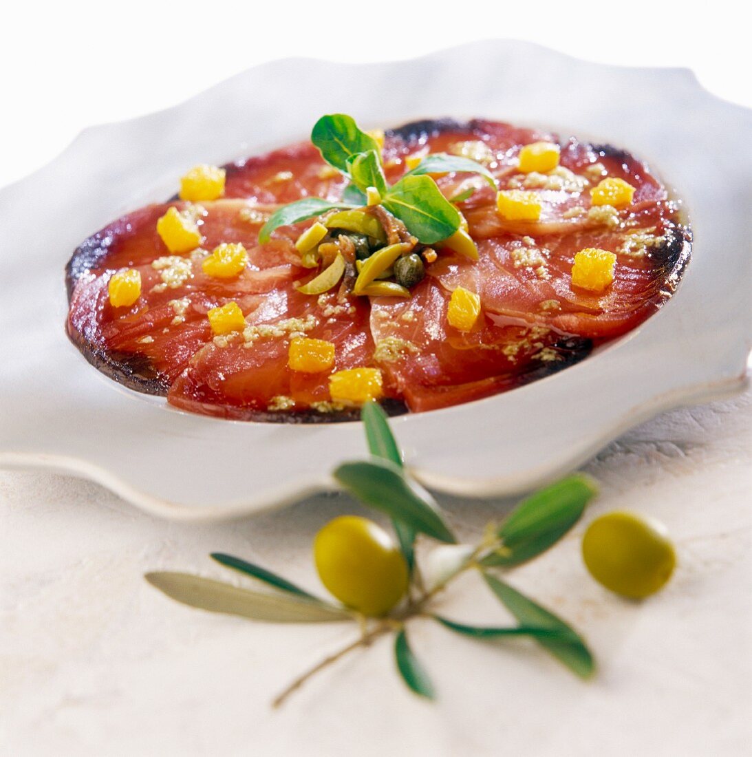 Tuna carpaccio with orange,capers and olives