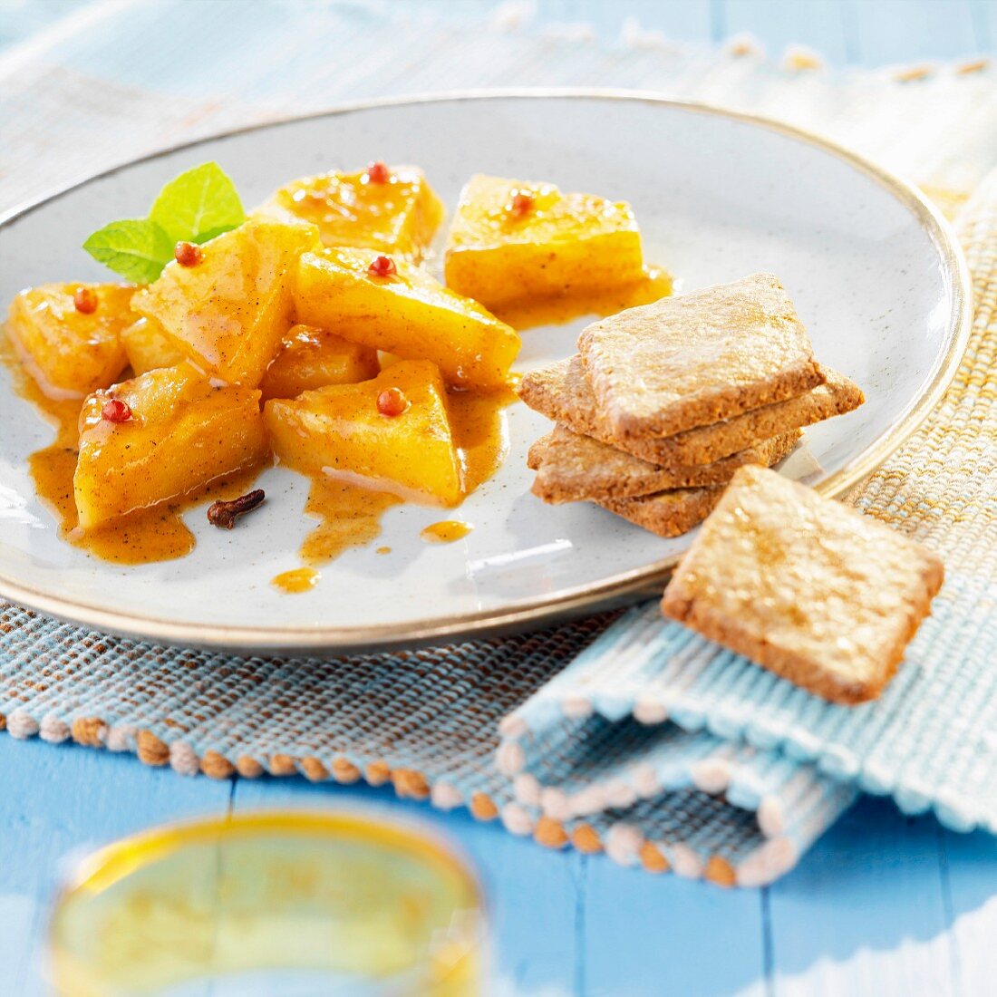 Pineapple with spices and ginger biscuits