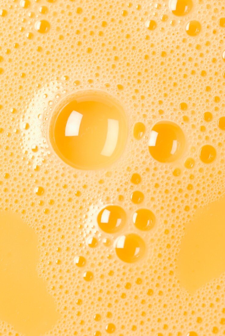 Close-up of beaten egg yolks with bubbles