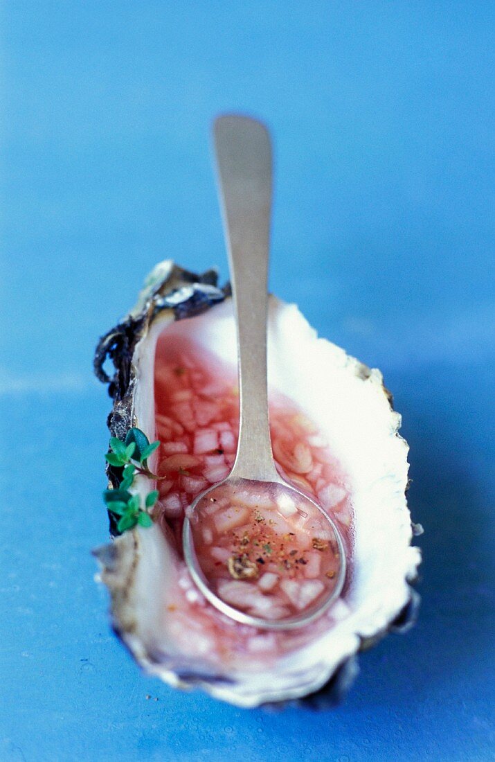 Shallot vinaigrette in an oyster shell