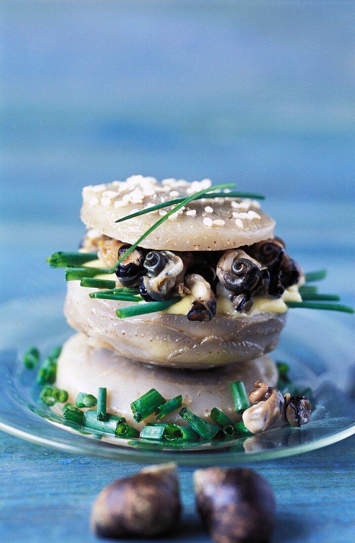 A Breton hamburger with an artichoke base, snails and chives