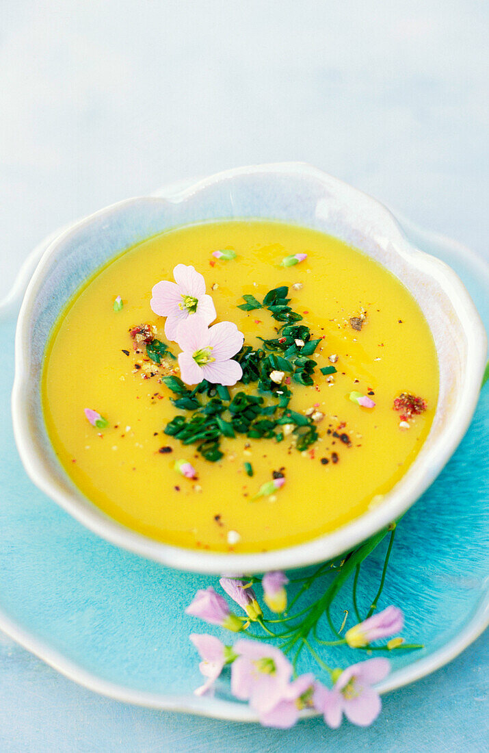 Carrot soup with chives and meadow cardamine