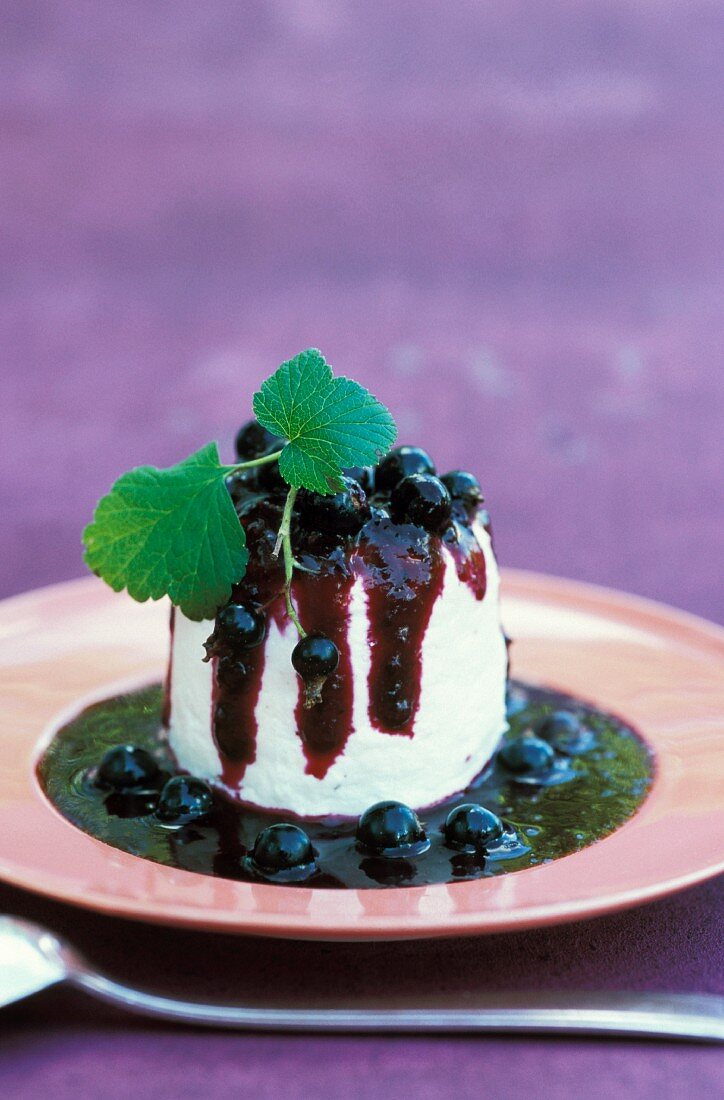 Faiselle with blackcurrant coulis and blackcurrants