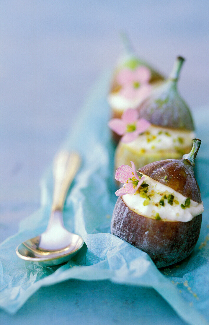 Fresh figs stuffed with fromage frais and meadow cardamine