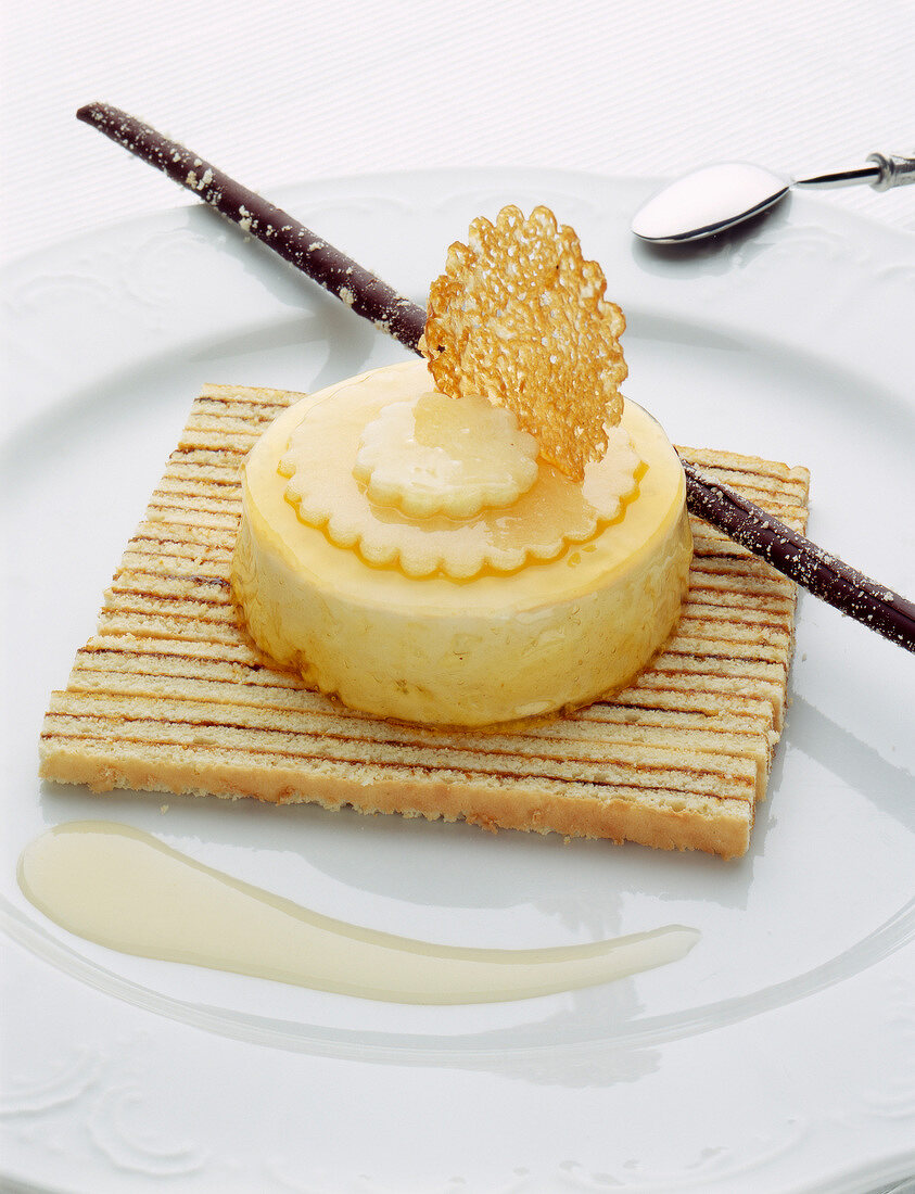 Lemon cream dessert on a bayadere almond-flavored sponge cake