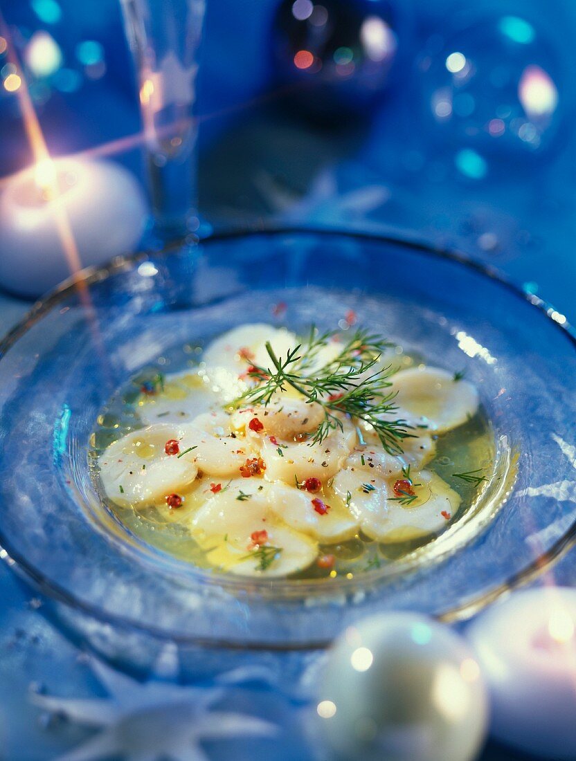 Scallops carpaccio with pink pepper and limes