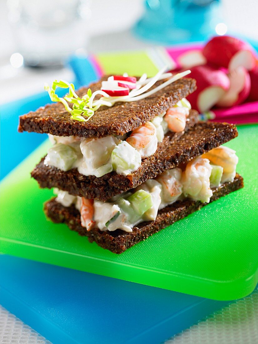 A prawn sandwich on black bread