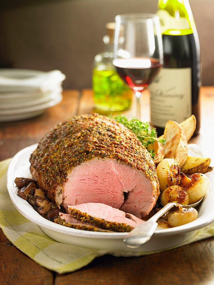 Roast saddle of lamb roulade with a mustard crust