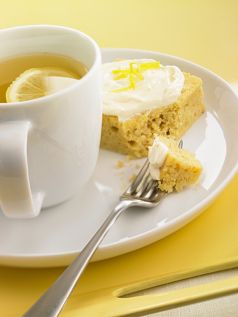 Tea with lemon and a slice of lemon cake