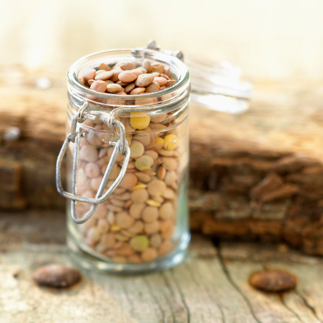 Small glass jar of pink lentils