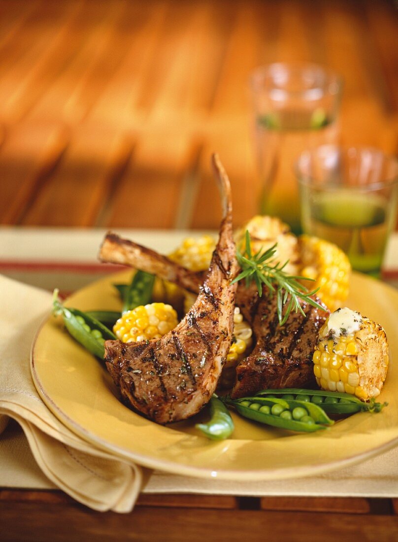 Lamb chops with sweetcorn and peas