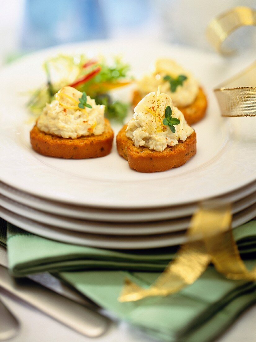 Crostini topped with chicken mousse