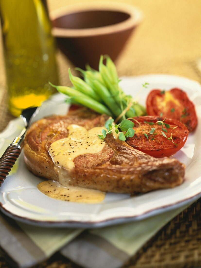 Veal chop with cheese sauce