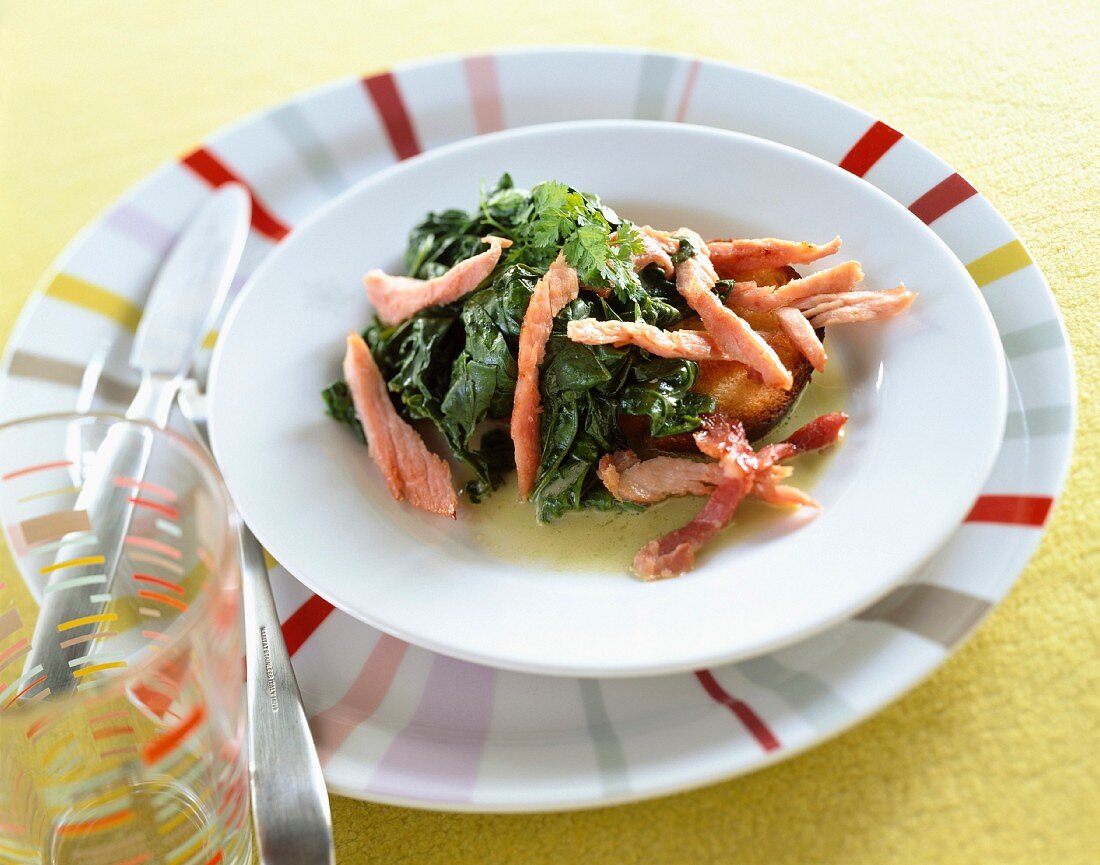 Spinach with strips of salmon