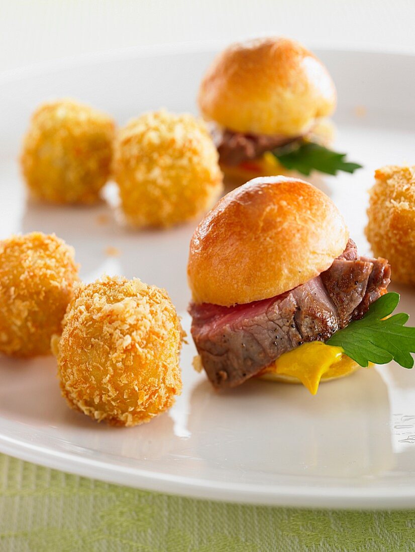 Potato croquettes and brioche rolls with beef