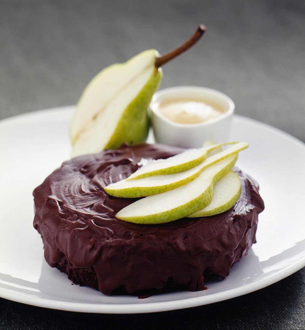 Soft chocolate cake with almonds and pear coulis