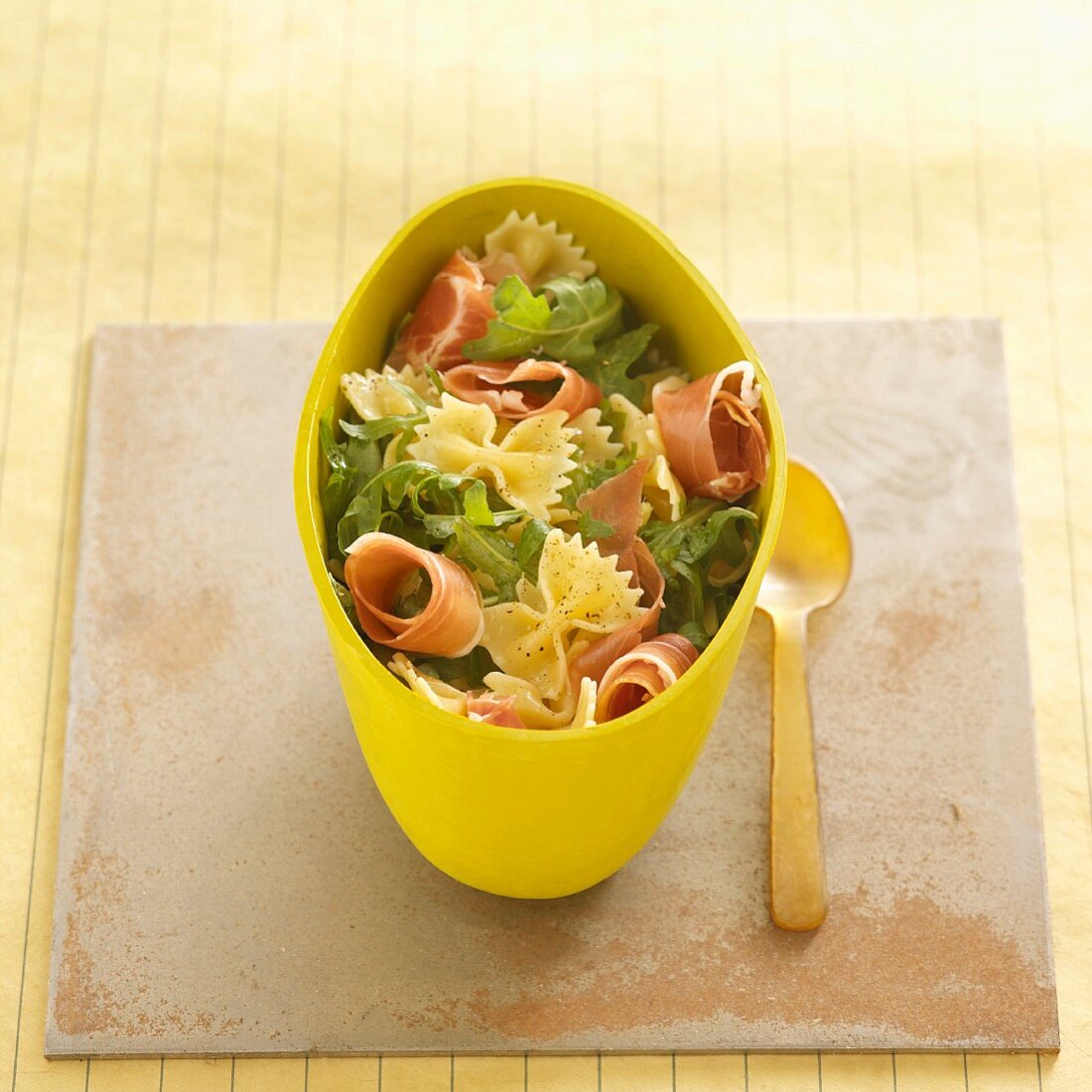 Pasta salad with farfalle and dry-cured ham