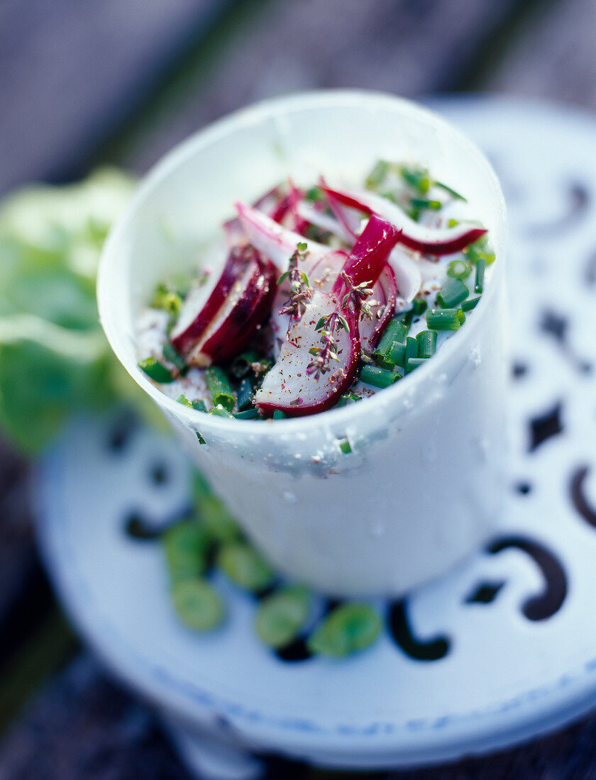 Faisselle with fresh herbs and cucumber