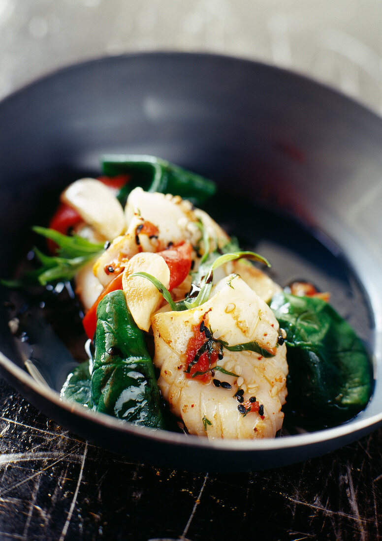 pan-fried squid with spinach and peppers