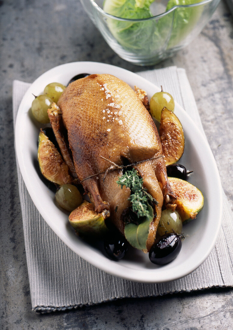 Whole roast duck with figs and raisins