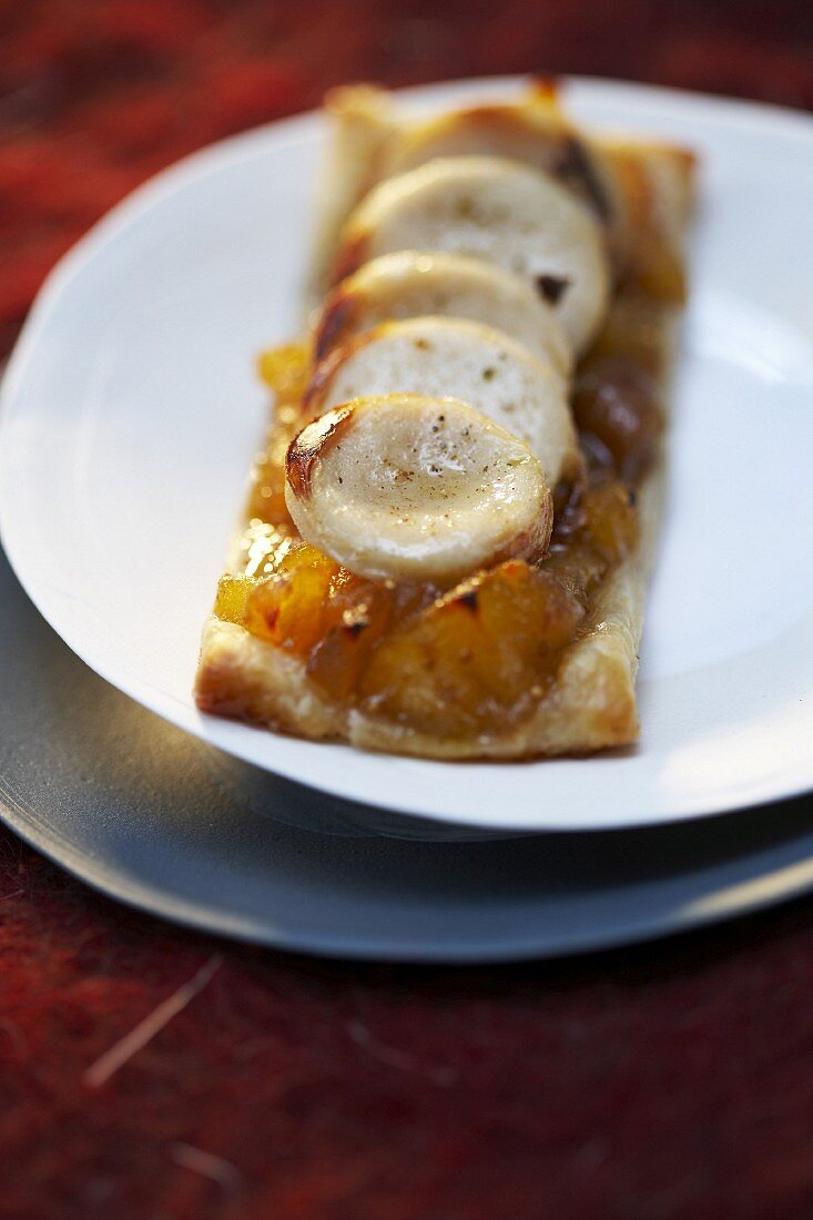 White sausage and fig chutney flaky pastry tart