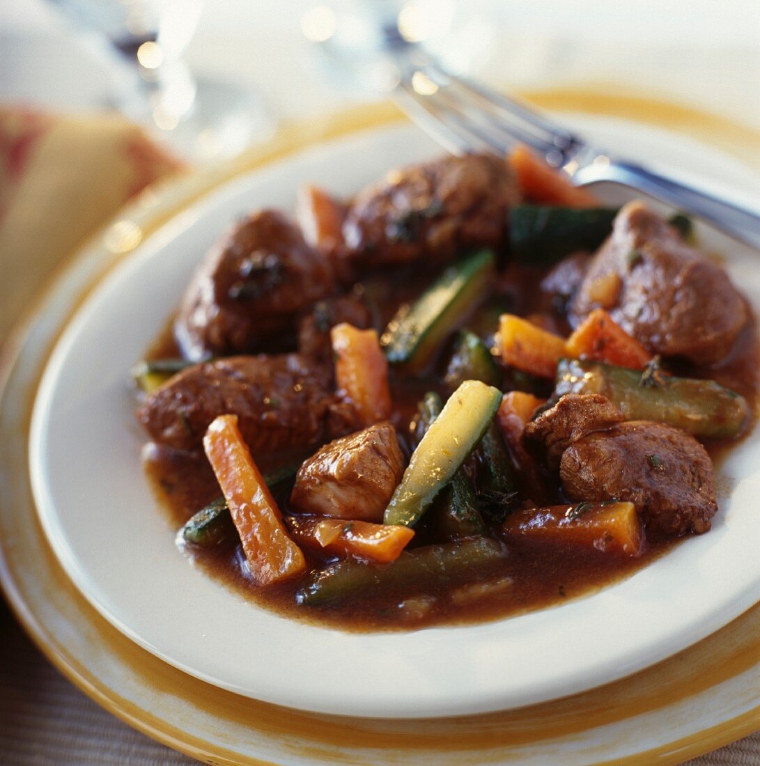 Lamb sauté with carrots and zucchinis