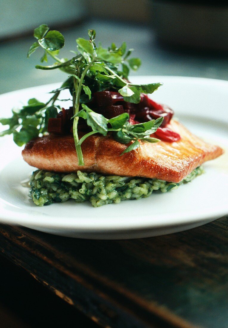 Pan-fried salmon ,herb risotto ,cress and beetroot
