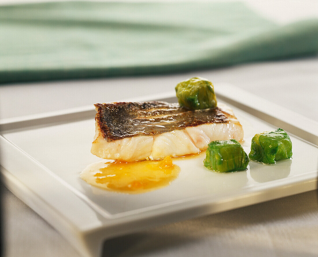 Fillet of St. Pierre with lettuce ravioli and peach marmalade