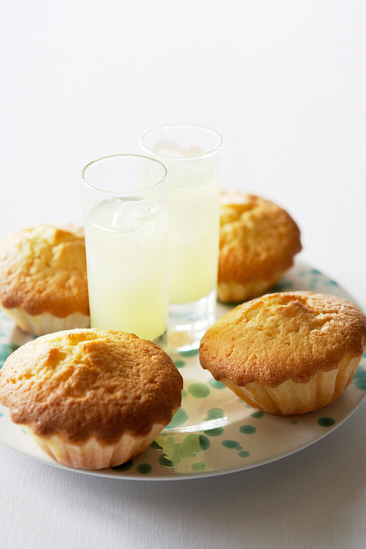 Two glasses of Limoncello and Limoncello cup cakes