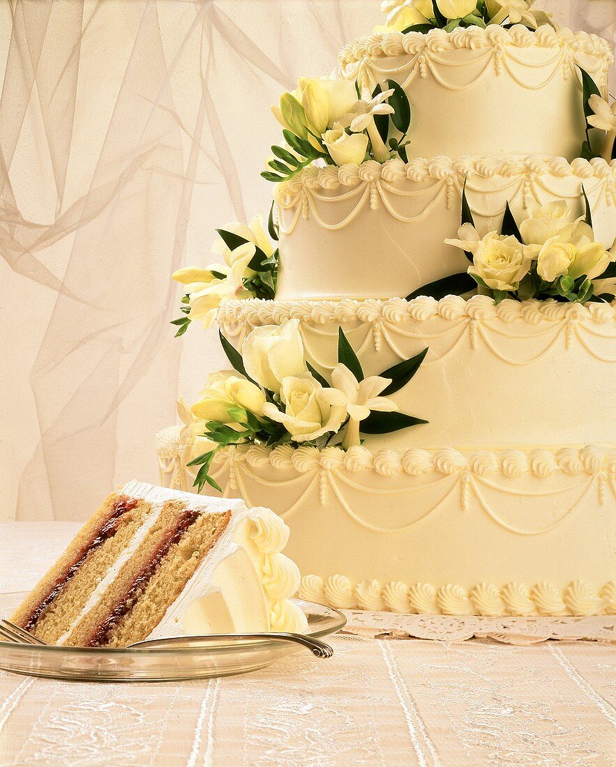 Four Tier Wedding Cake with Yellow Flowers