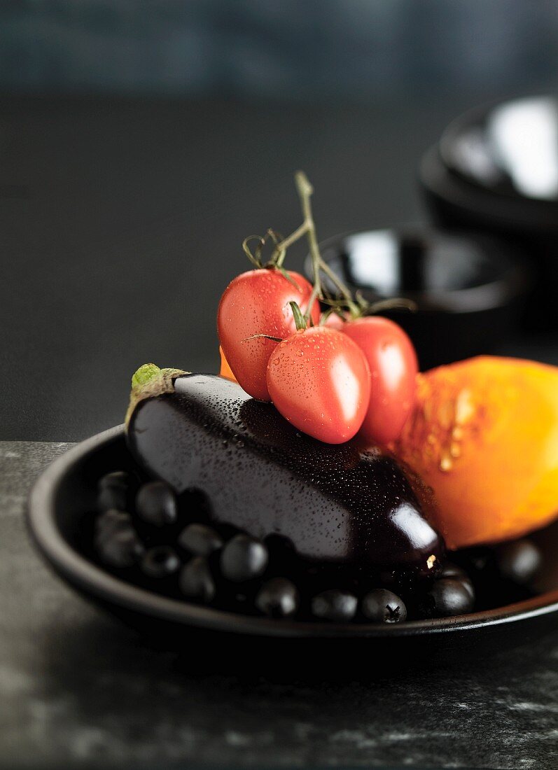 Tomatoes, aubergines, pumpkin and black olives