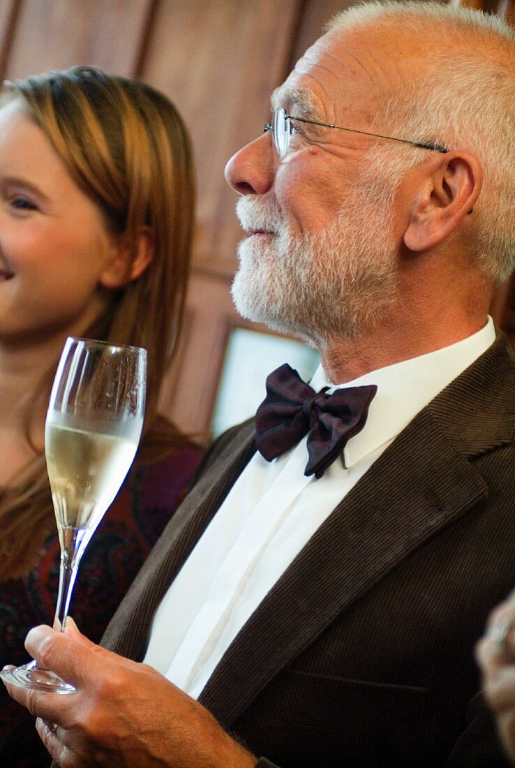 Man holding a glass of champagne