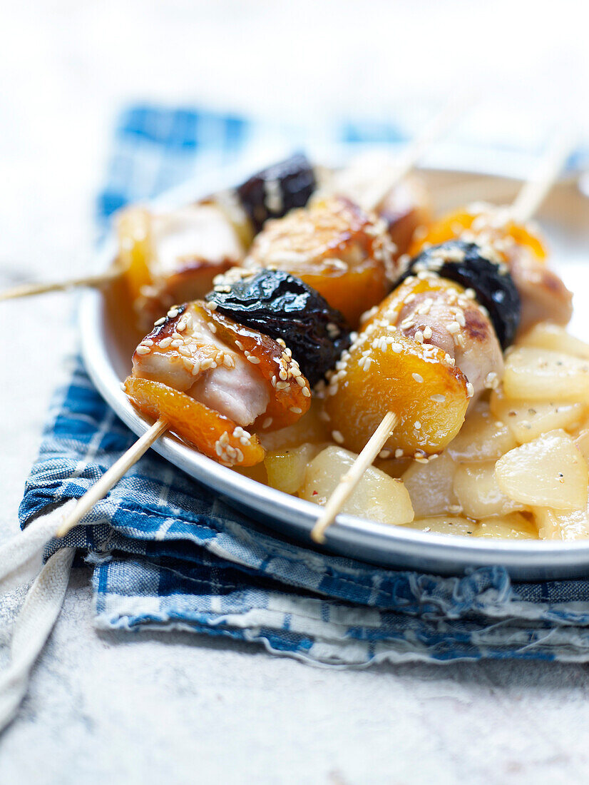 Rabbit,dried apricot,plum and sesame seed skewers