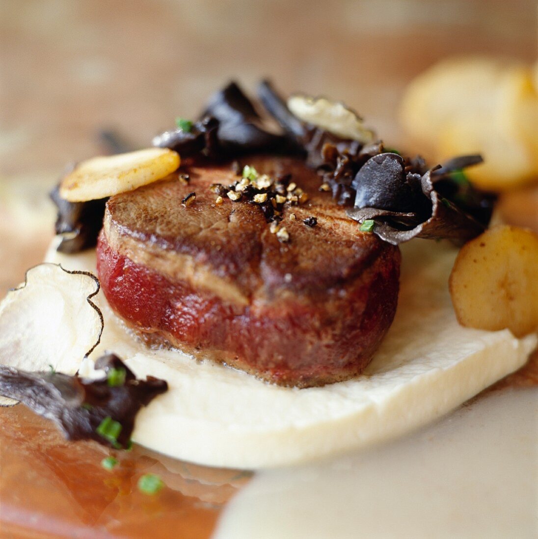 Beef tournedos with wood ear mushrooms on goat's cheese