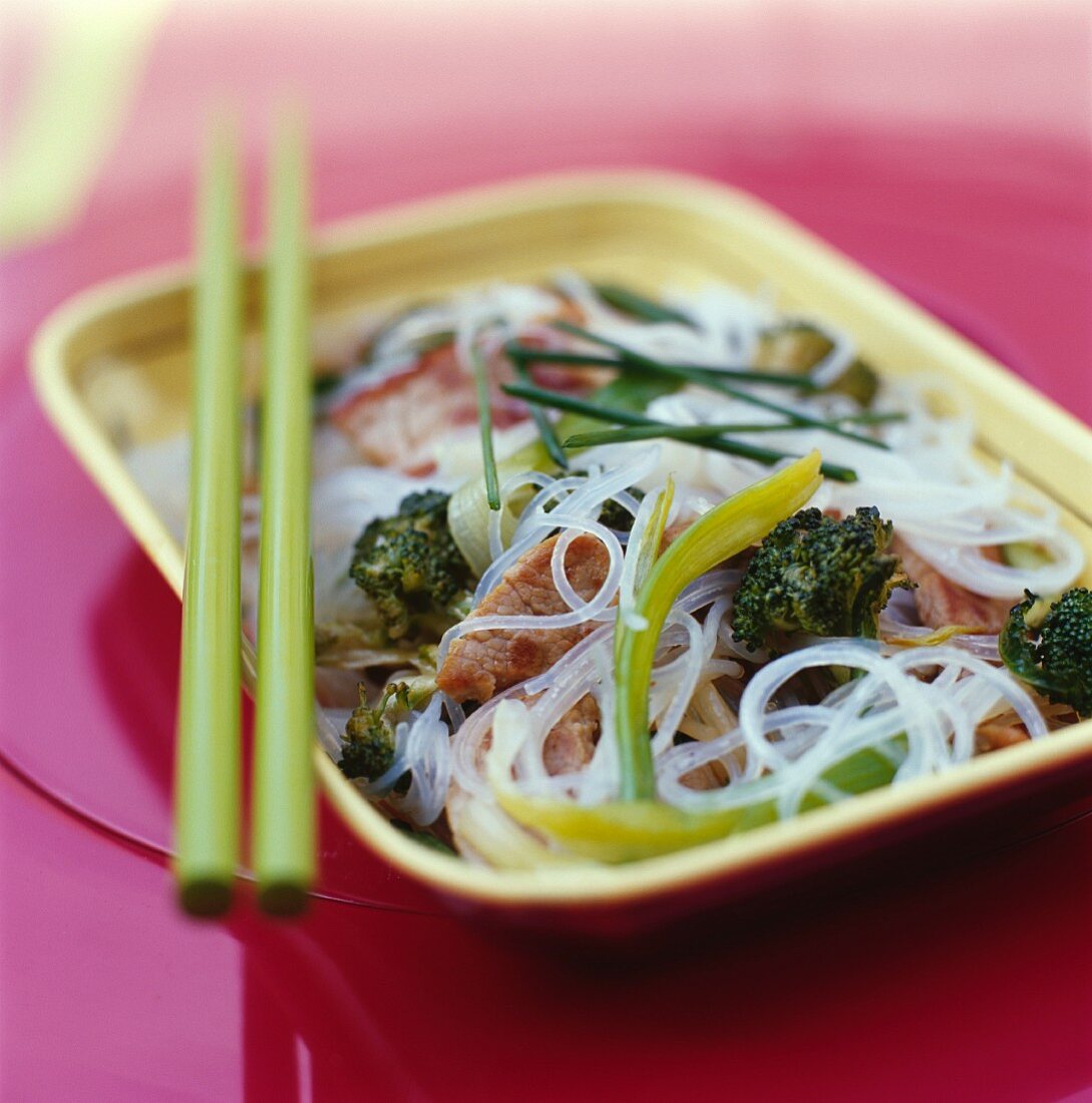 Sautéed pork with broccoli and rice noodles