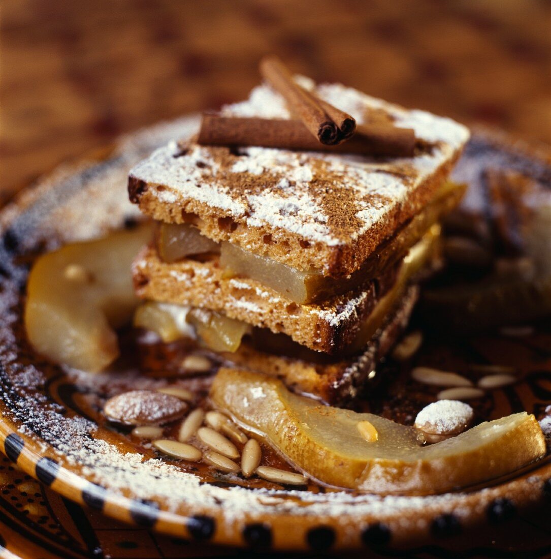 A layer cake made from honey cake, apple and cinnamon