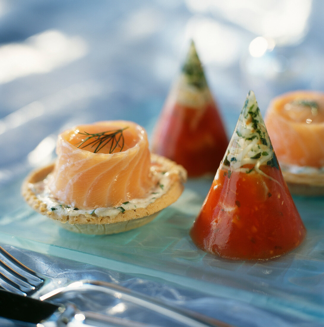 Salmon and dill tartlets and tomato and aspic cones