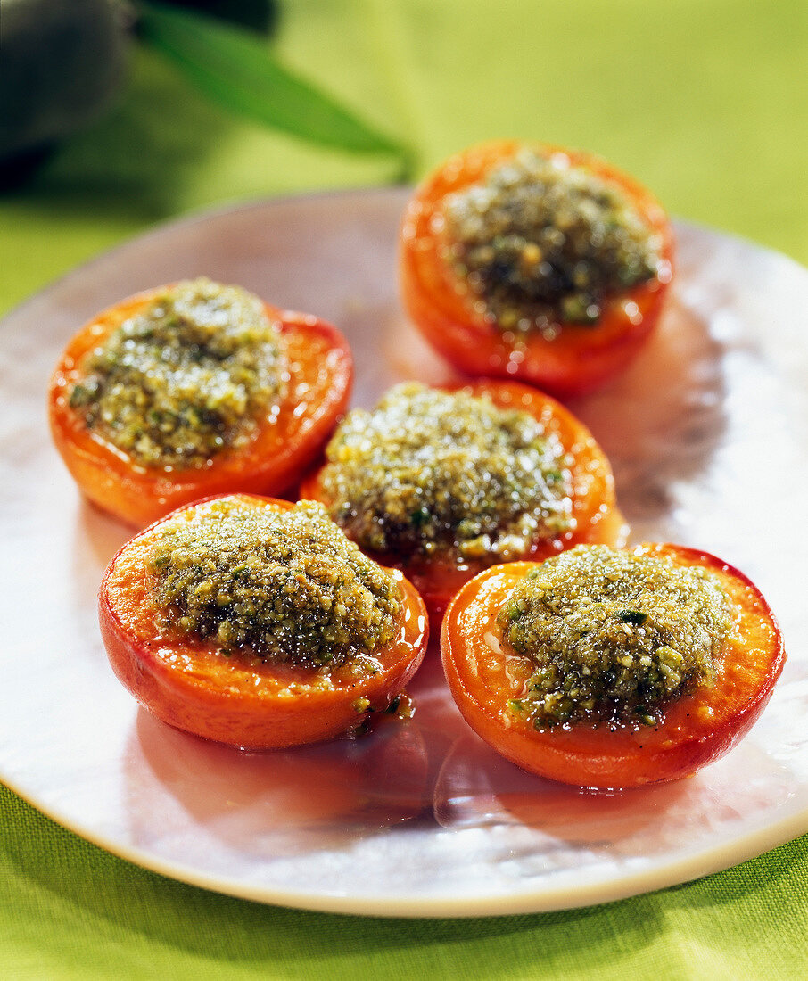 Apricots garnish with crushed pistachios and pistachios