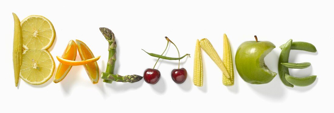 The word "Balance" written with vegetables and fruit