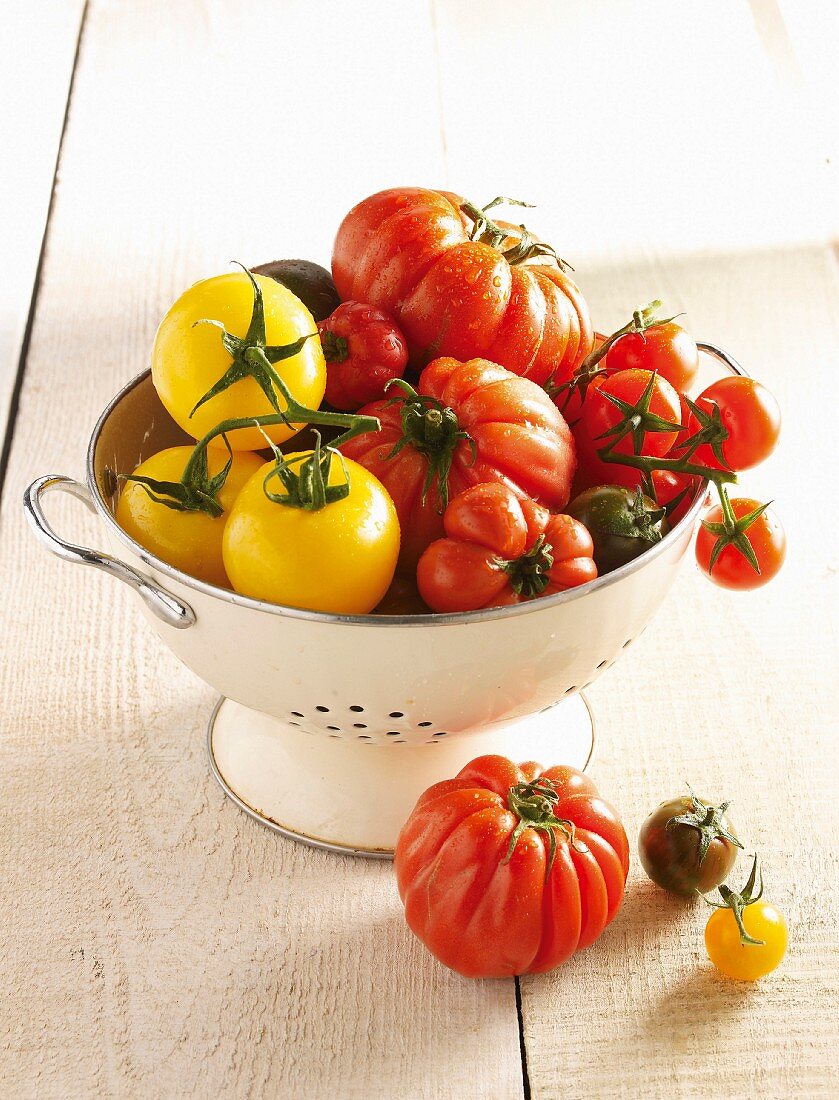 Assorted tomatoes in colander