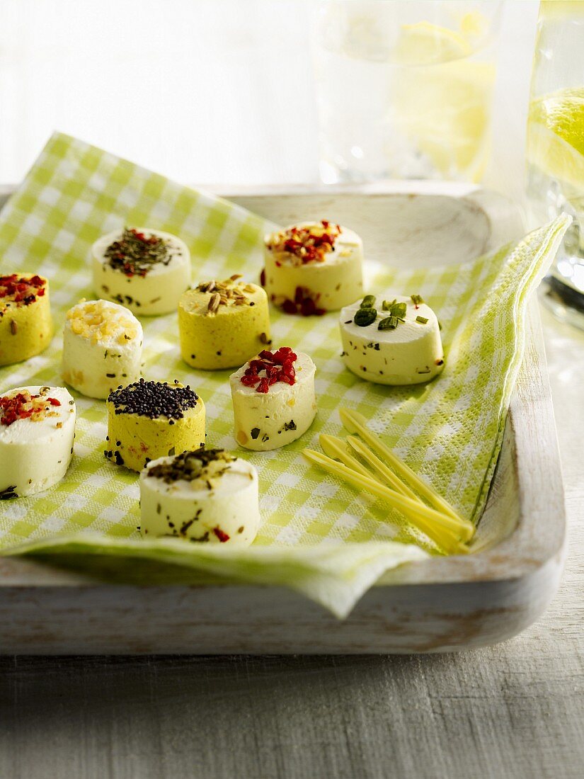 Different flavored mini goat's cheese appetizers