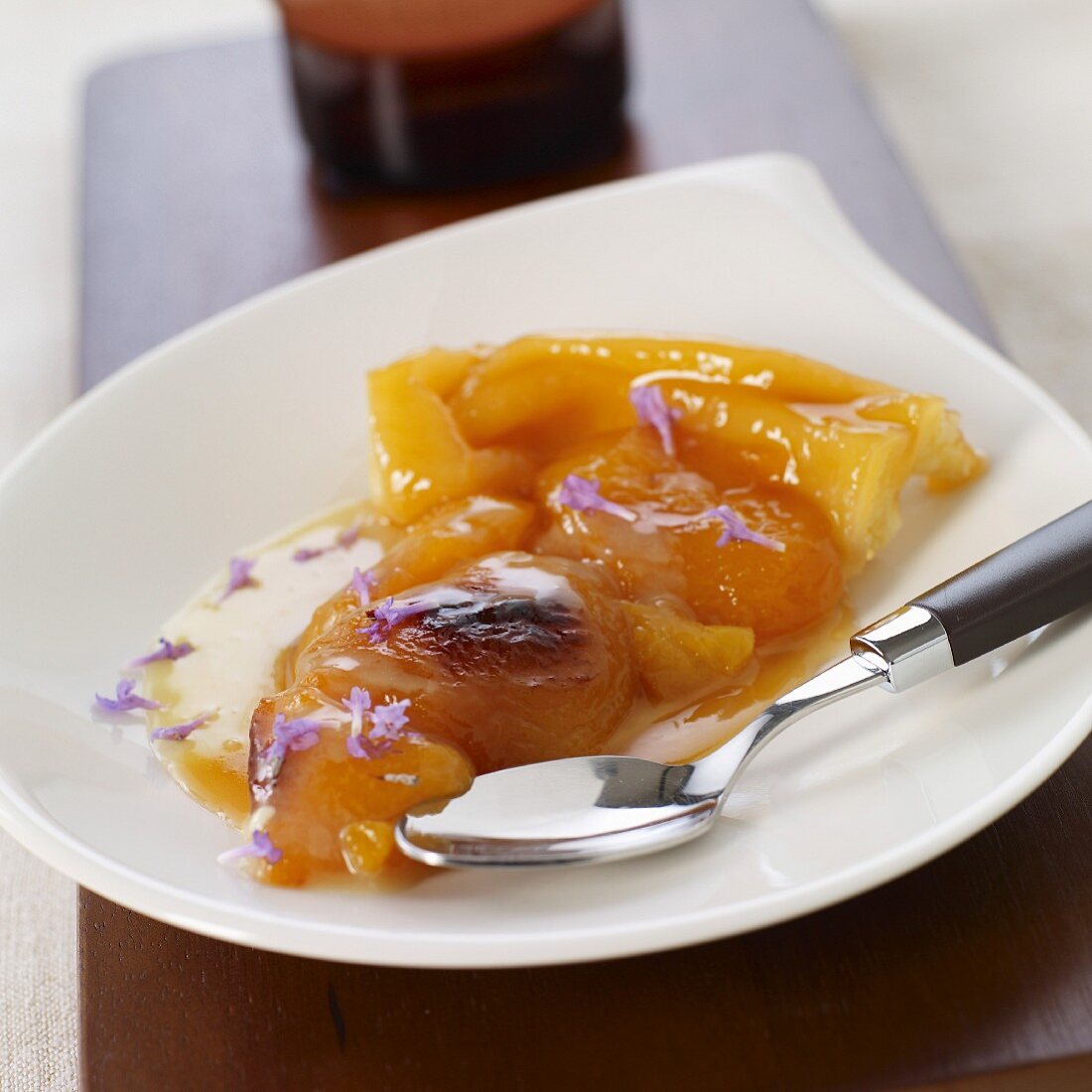 Portion of upside-down apricot tart