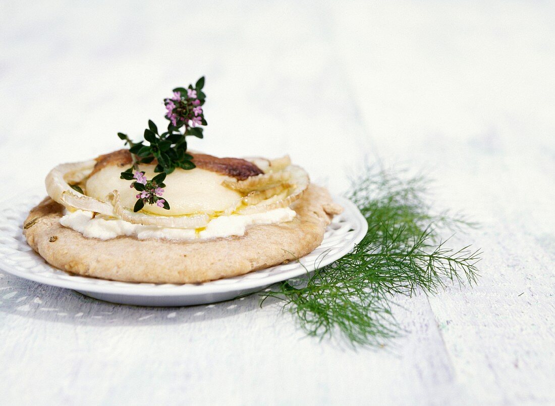 Pizza with fennel, anchovies, Cabécou cheese and Brousse cheese