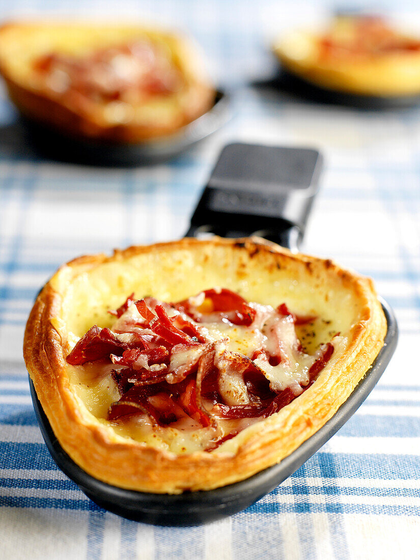 Raclette cheese and grisons meat tart
