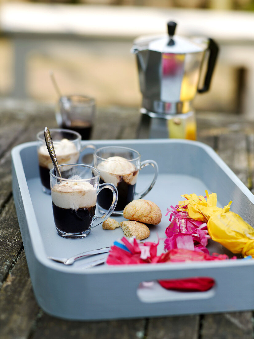 Cups of coffee with vanilla ice cream and Amarettis