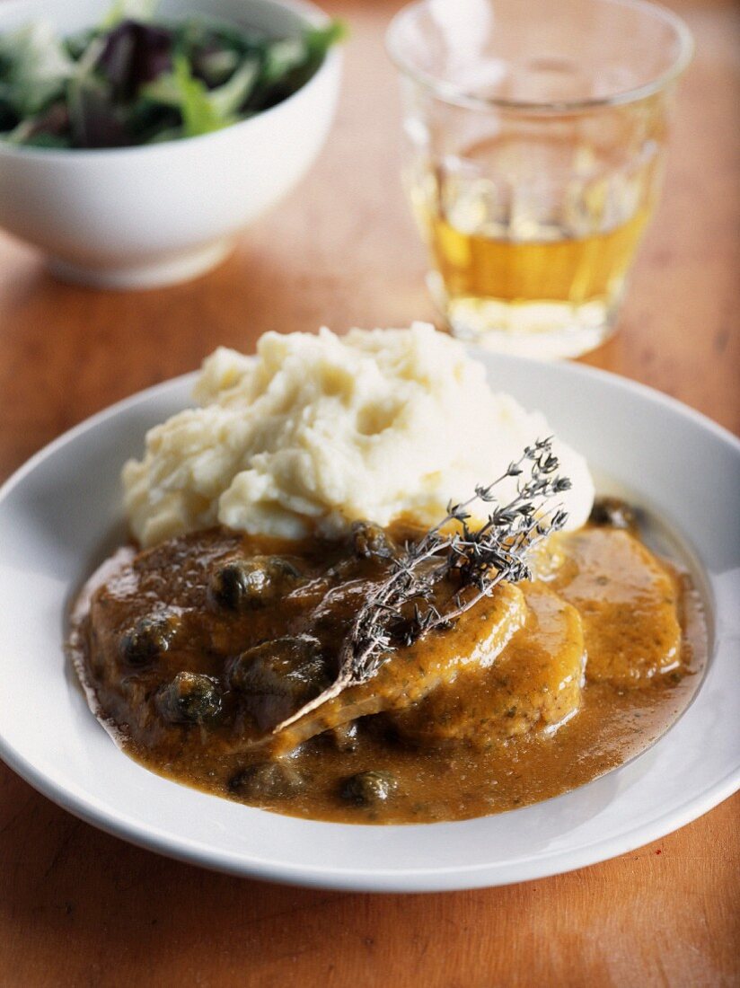Beef toungue with spicy sauce with capers and mashed potatoes