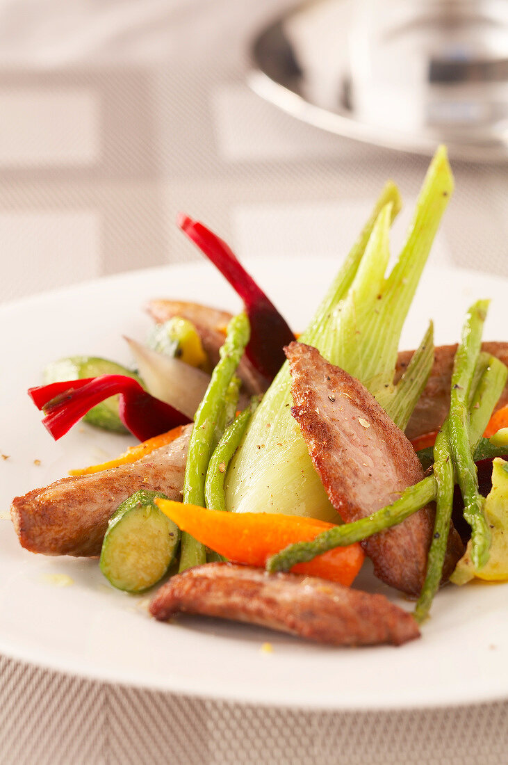 Sliced duck's breast with confit summer vegetables